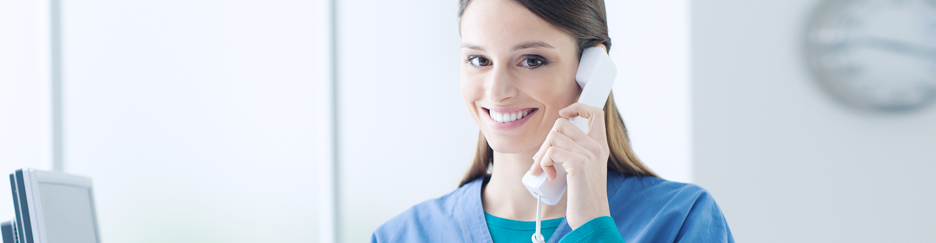 nurse on the phone smiling
